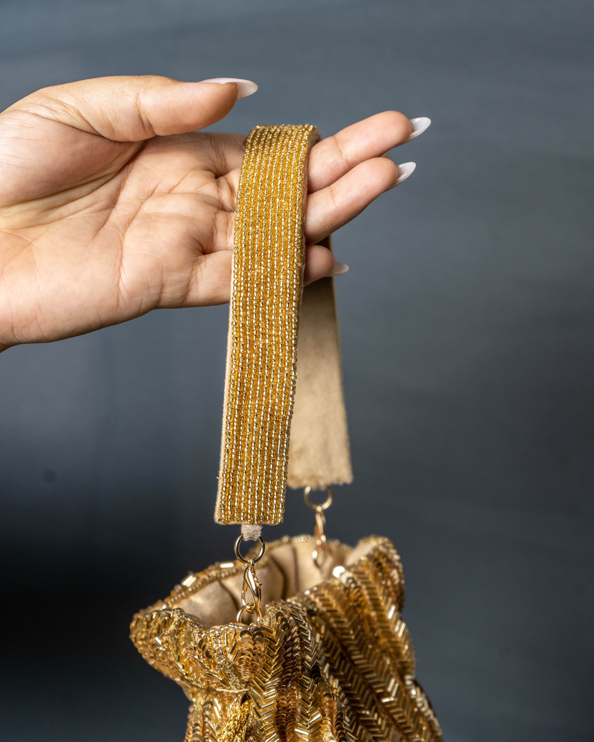 Sitara Gold Fringe Potli – Hand-Beaded Party Bag with Crystal Tassels