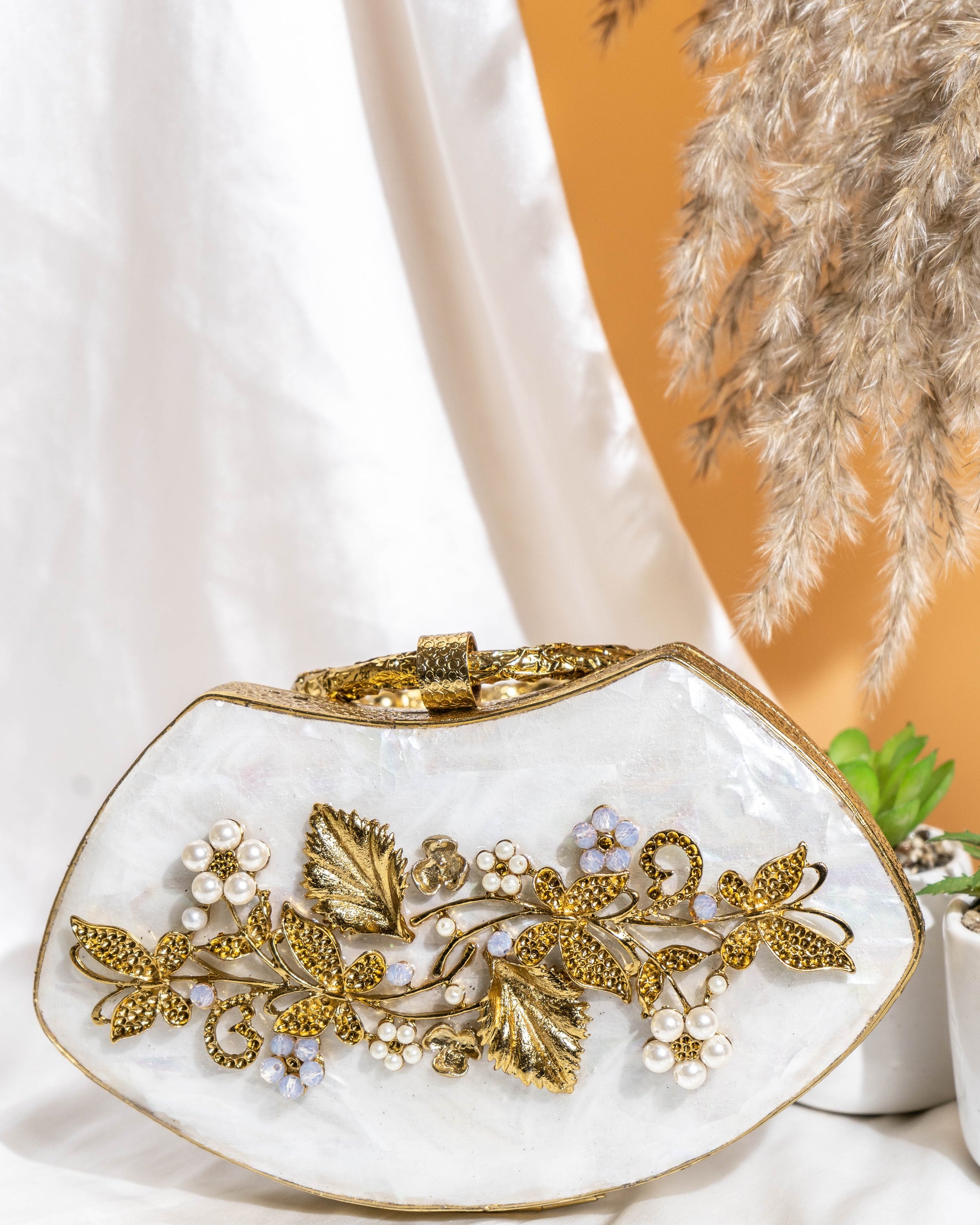 Noura Embellished MOP Clutch with Floral Gold Detailing