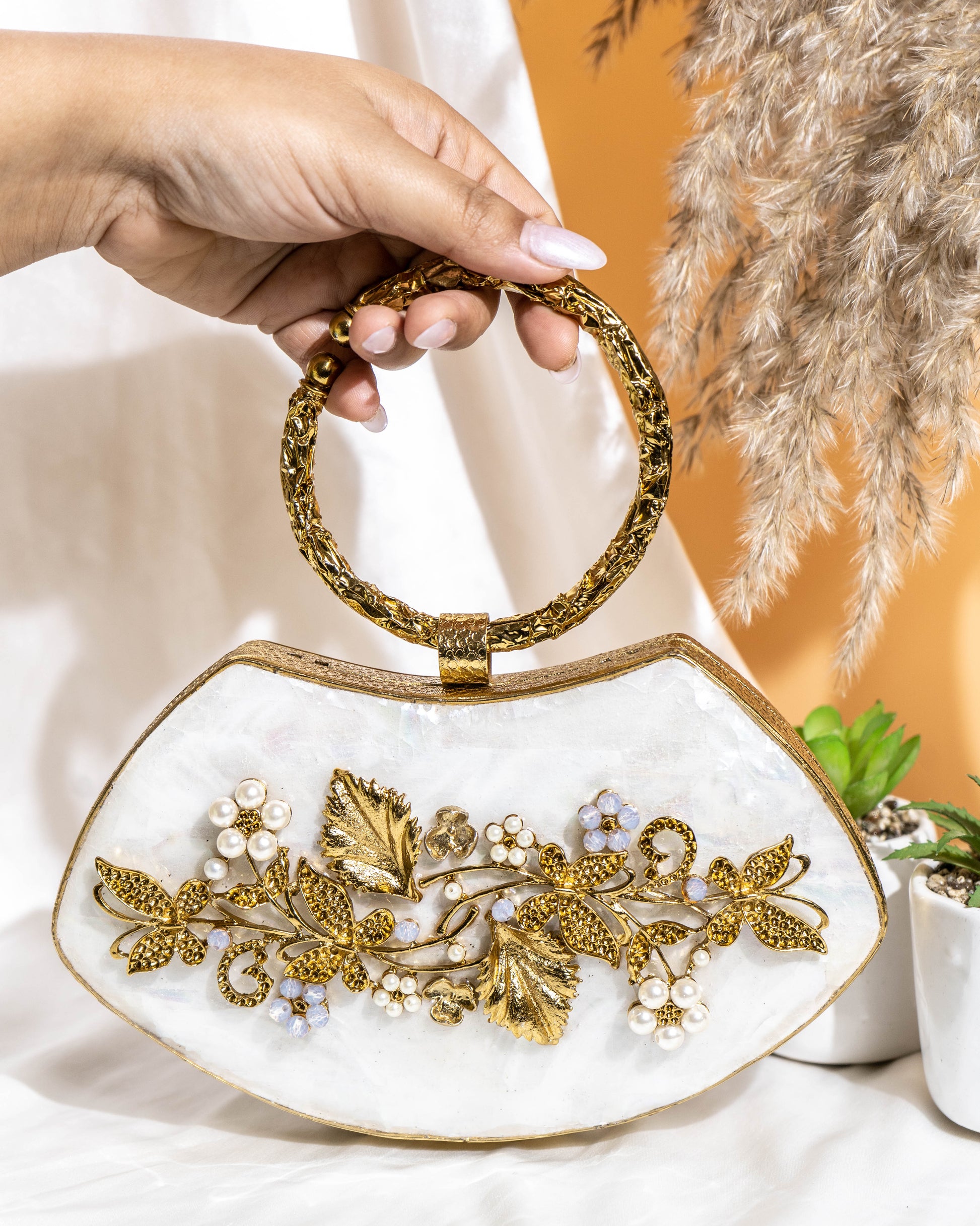 Noura Embellished MOP Clutch with Floral Gold Detailing