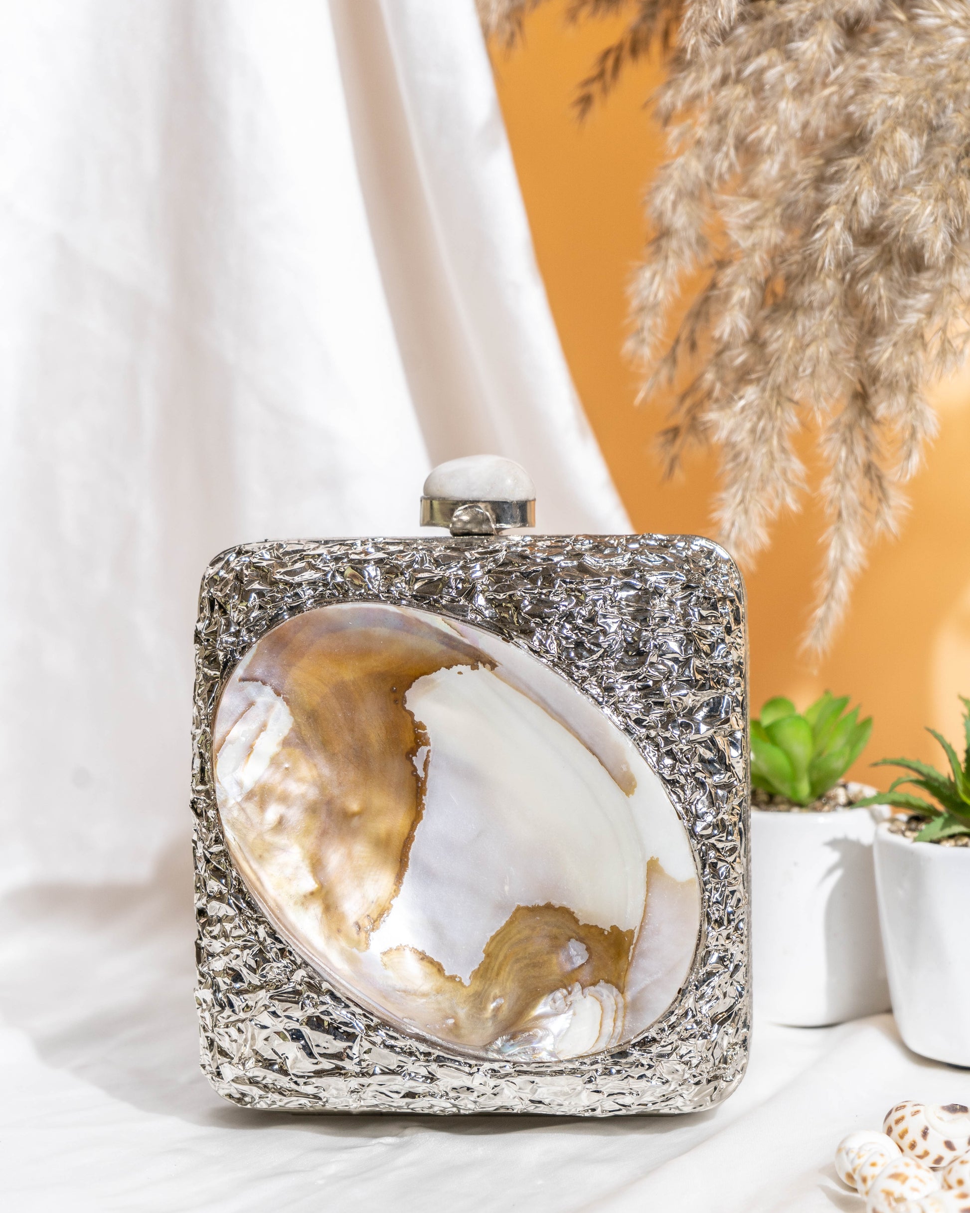 Kaia Raw Shell Metal Clutch