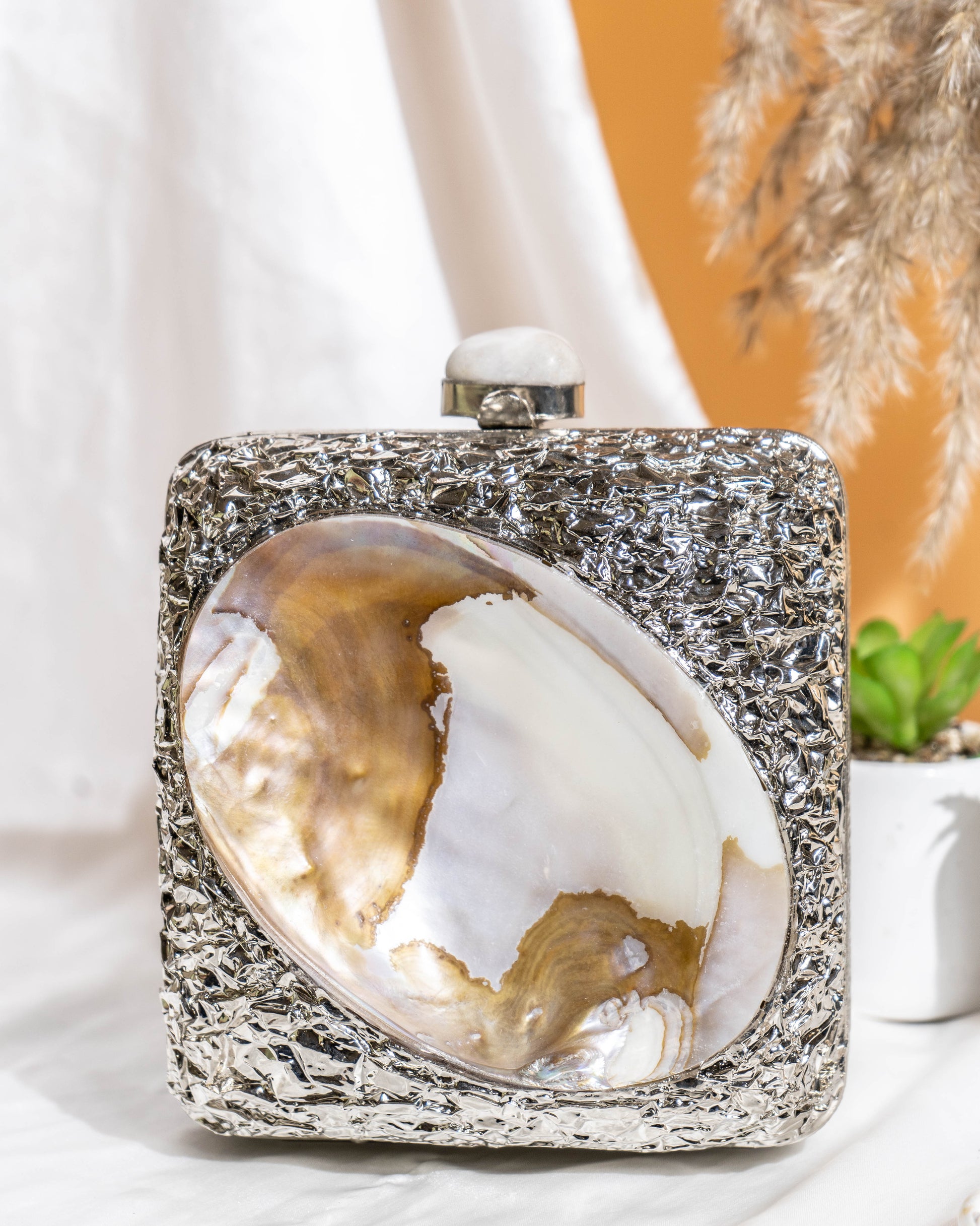Kaia Raw Shell Metal Clutch