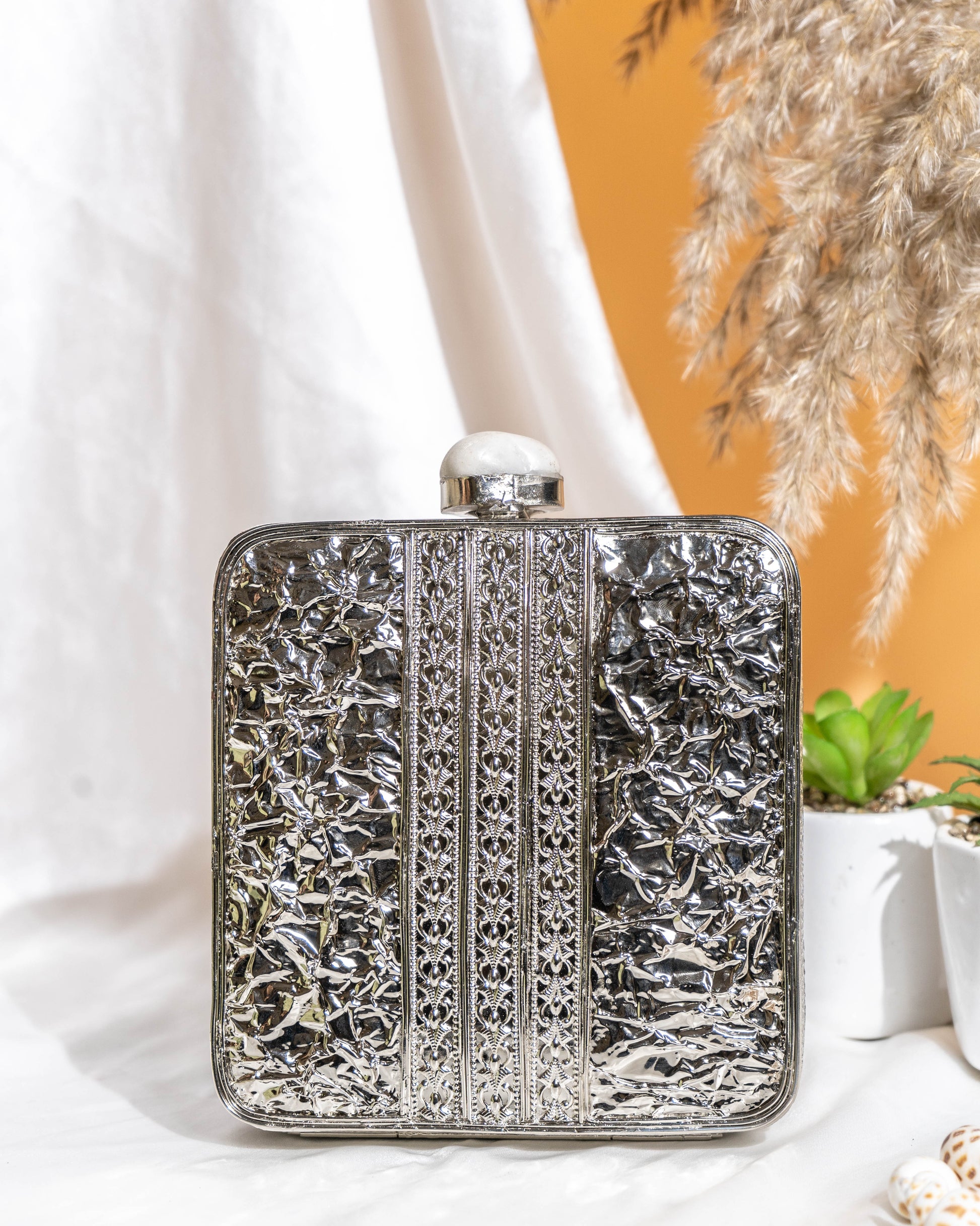 Kaia Raw Shell Metal Clutch