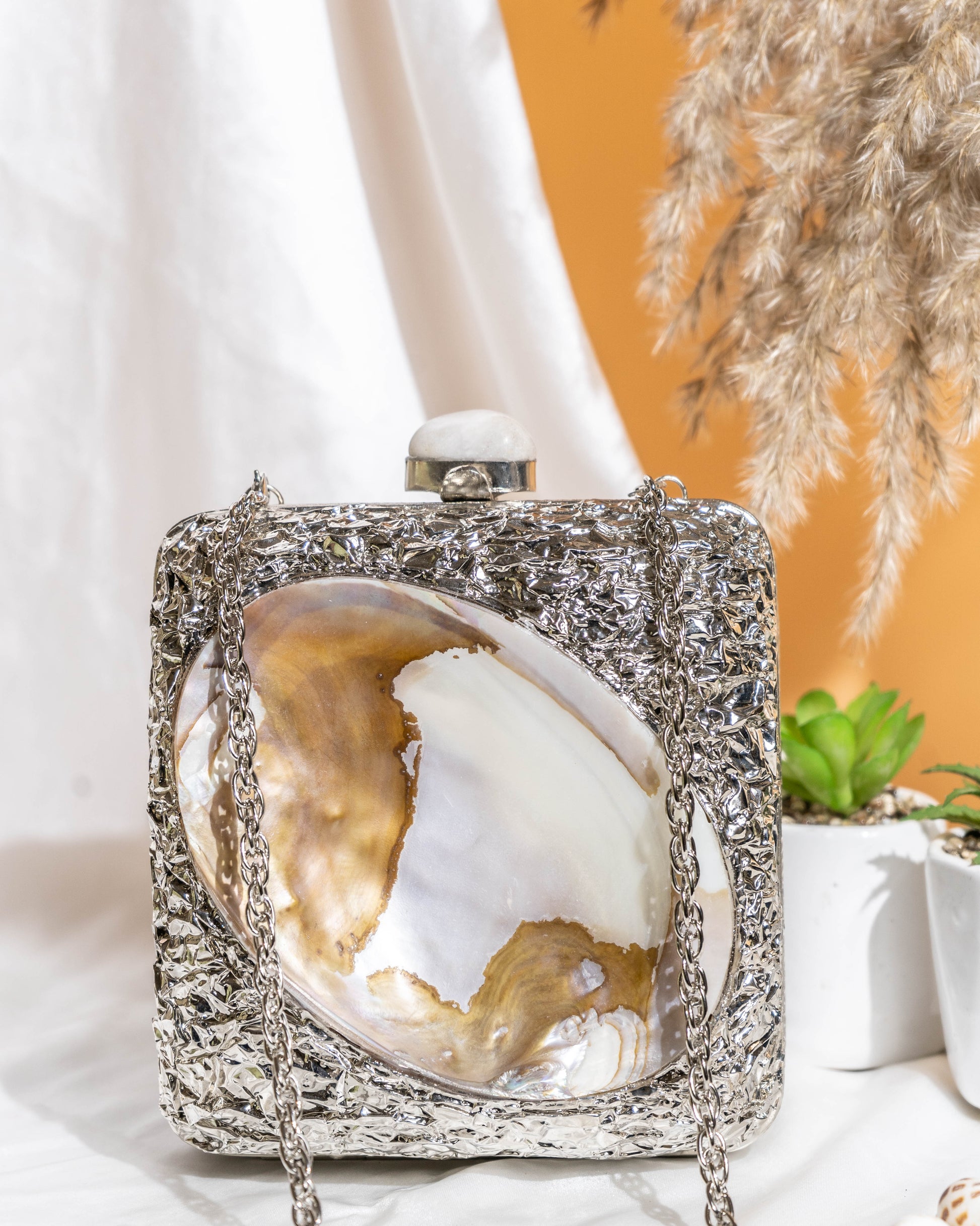 Kaia Raw Shell Metal Clutch