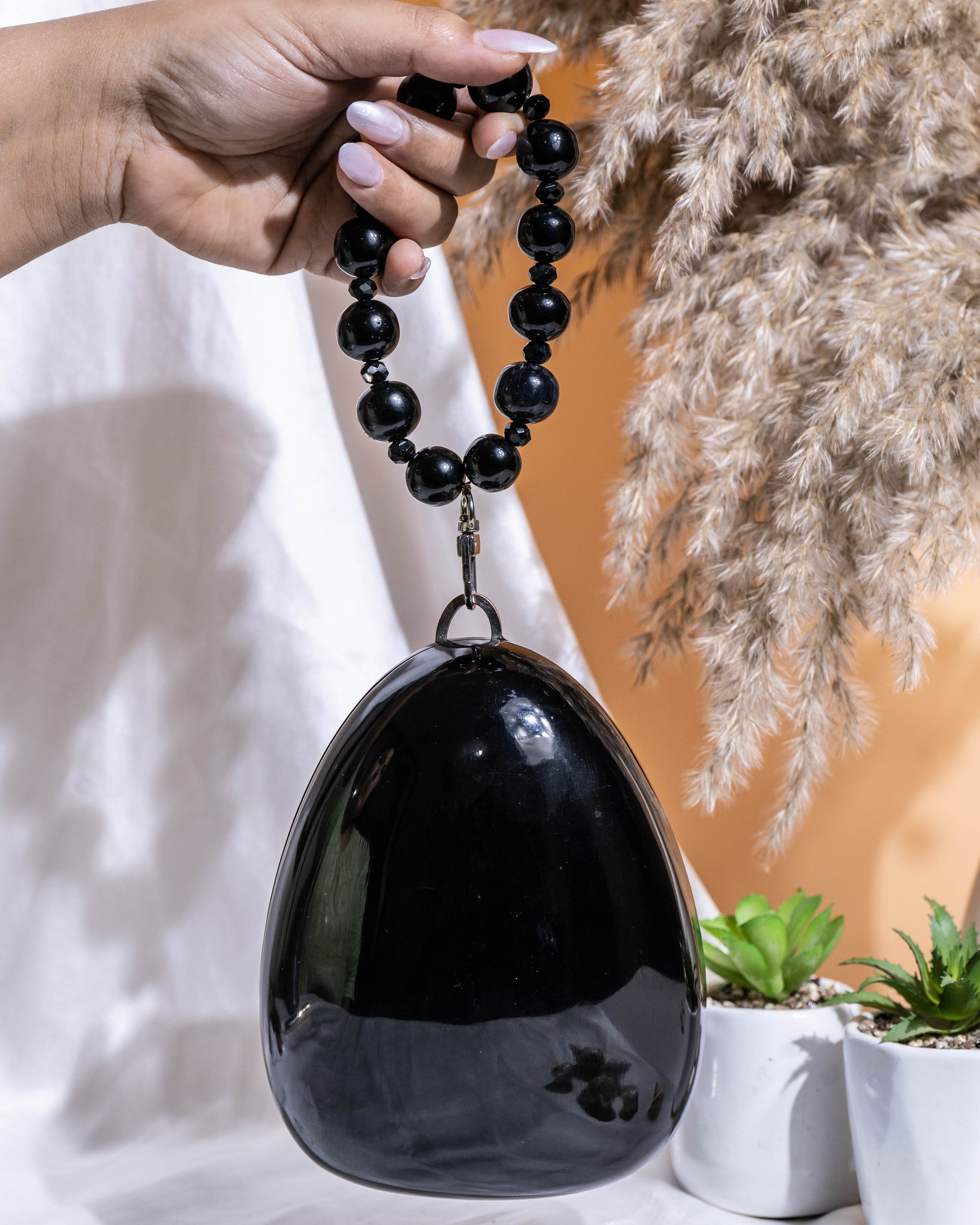 Noir Pebble Orb Clutch