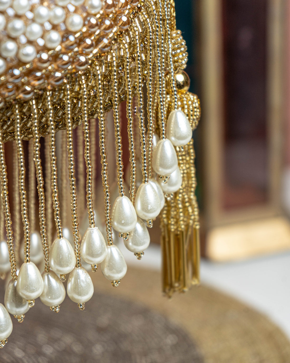 Seraphina Gleam Potli – Golden Pearl Drop Embellished Bag