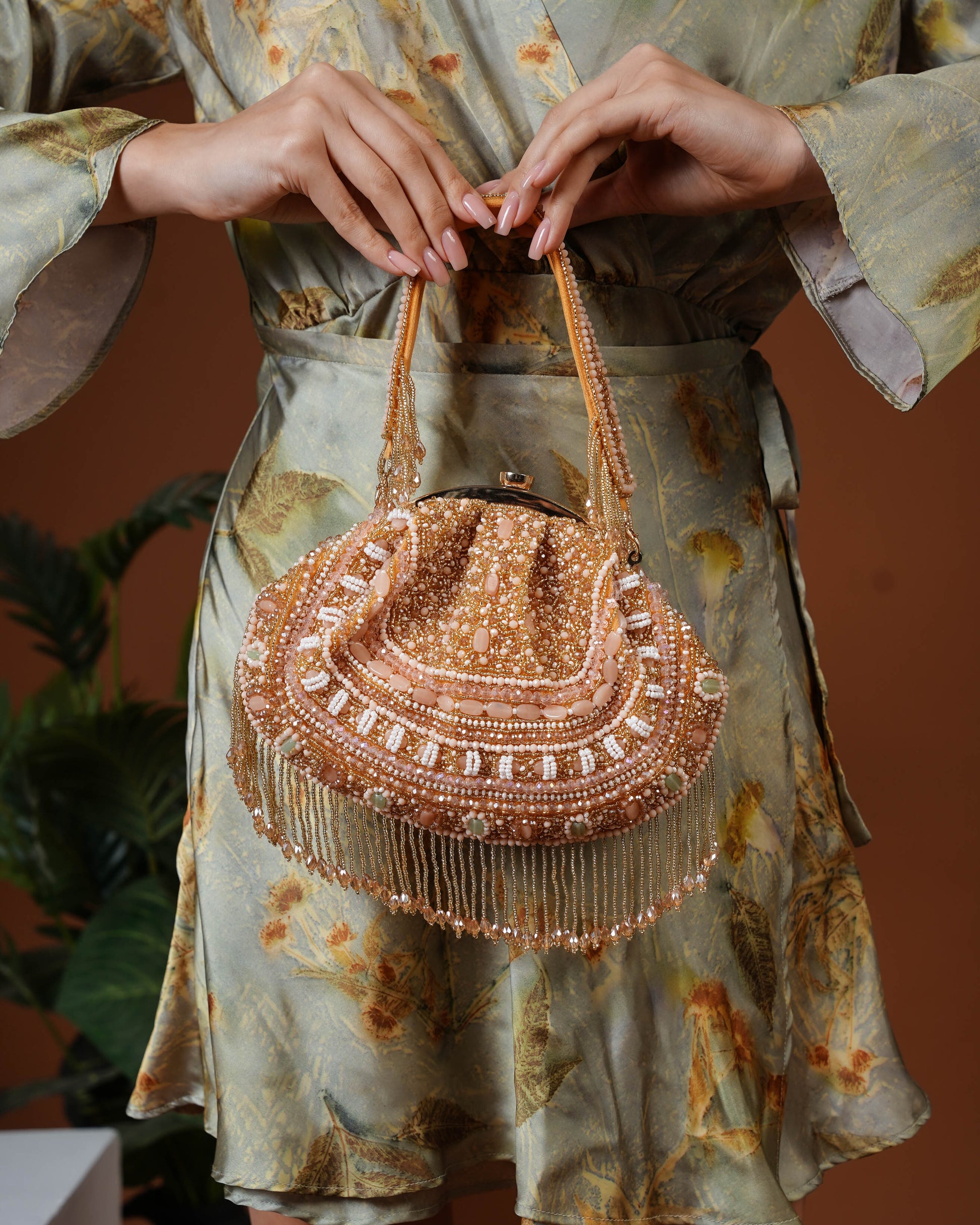 Golden Beaded Handbag with Fringe Detailing