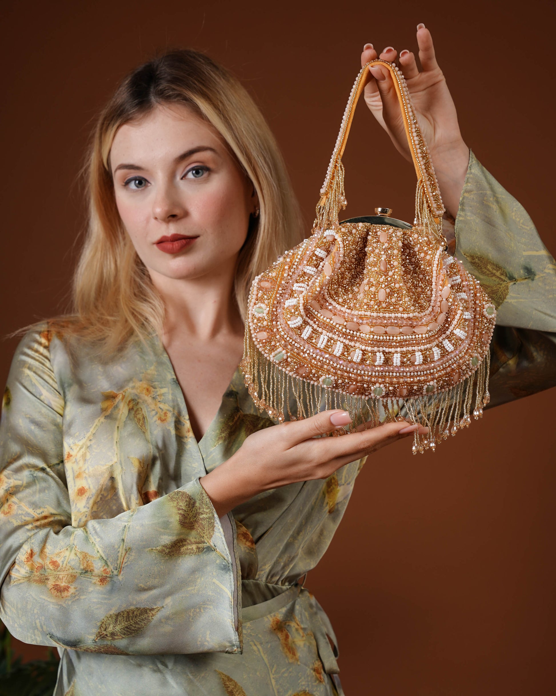 Golden Beaded Handbag with Fringe Detailing