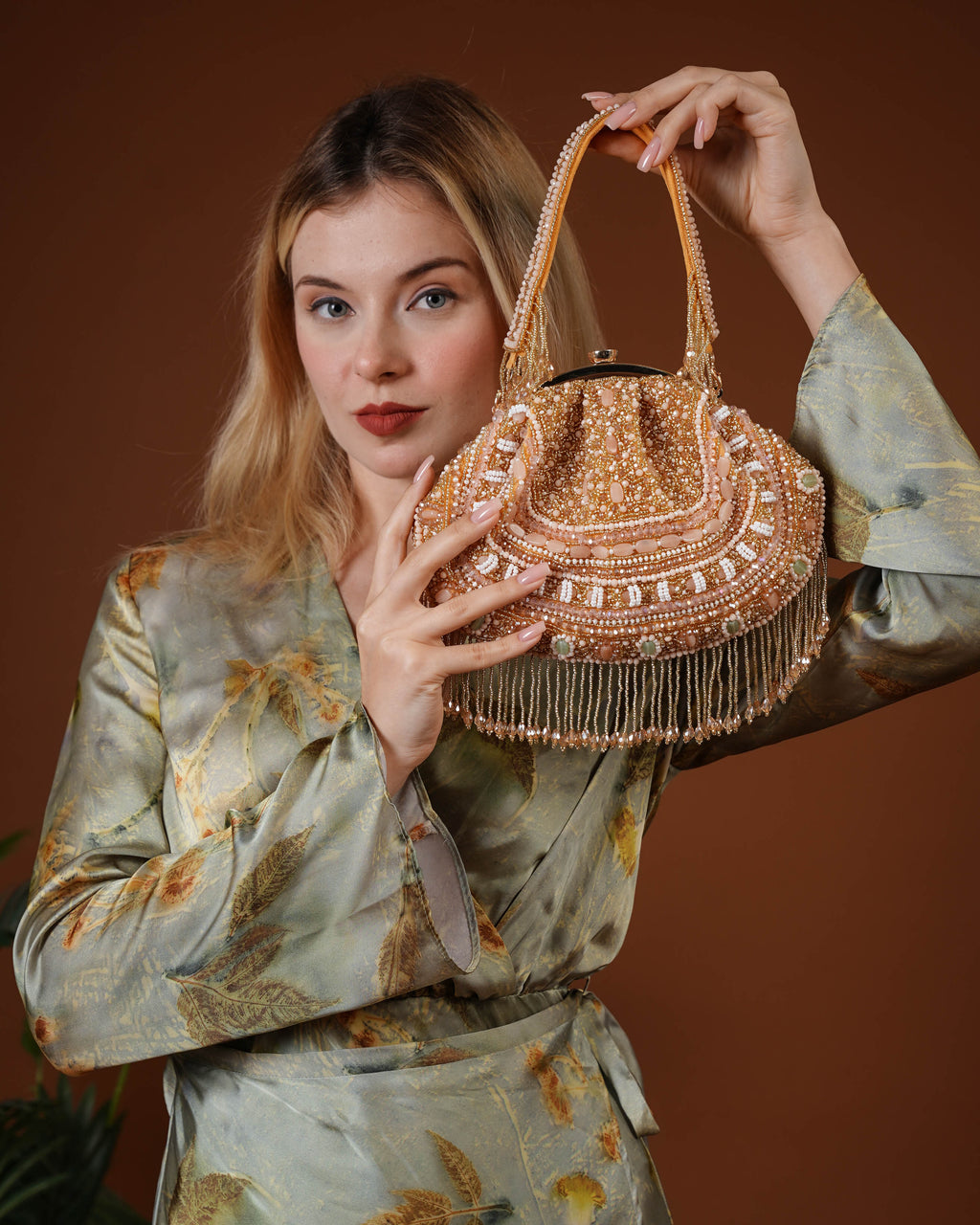 Golden Beaded Handbag with Fringe Detailing